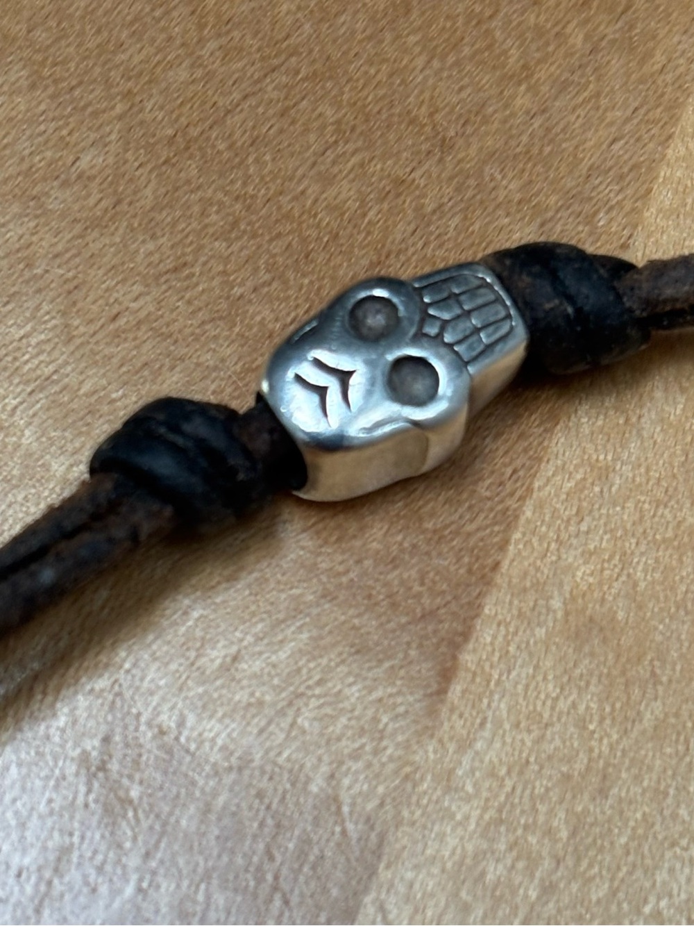 Me & Ro Sterling Silver Skull Bracelet on Brown Leather Cord